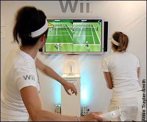 Players in front of Wii Tennis screen
